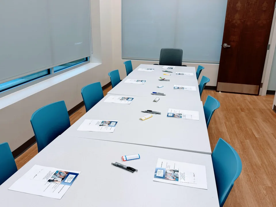 Shared Medical Appointment setup — conference room with materials ready for participants